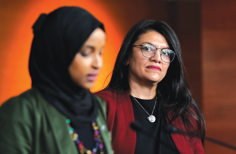  US REPRESENTATIVE Ilhan Omar speaks as Representative Rashida Tlaib looks on at a news conference, on Capitol Hill, in 2021. (credit: Elizabeth Frantz/Reuters)