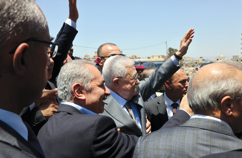  Palestinian Authority President Mahmoud Abbas visits the Jenin Refugee Camp, July 12.  (credit: PPO/Handout/REUTERS)