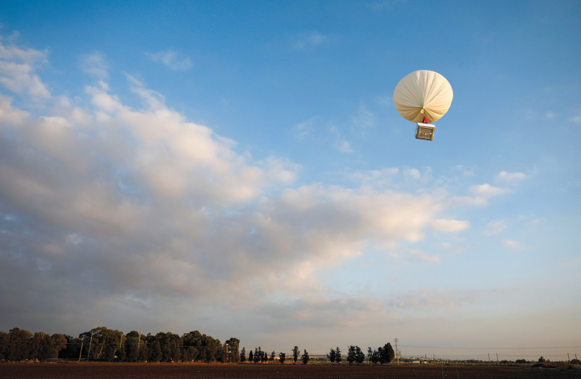  The demonstration in Petah Tikva by Israeli start-up High Hopes Labs of a balloon that captures carbon directly from the atmosphere at a high altitude. (credit: AMIR COHEN/REUTERS)