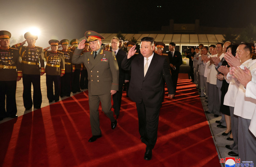  North Korean leader Kim Jong Un and Russia's Defense Minister Sergei Shoigu salute during a visit to an exhibition of armed equipment on the occasion of the 70th anniversary of the Korean War armistice, in this image released by North Korea's Korean Central News Agency on July 27, 2023 (credit: KCNA VIA REUTERS)