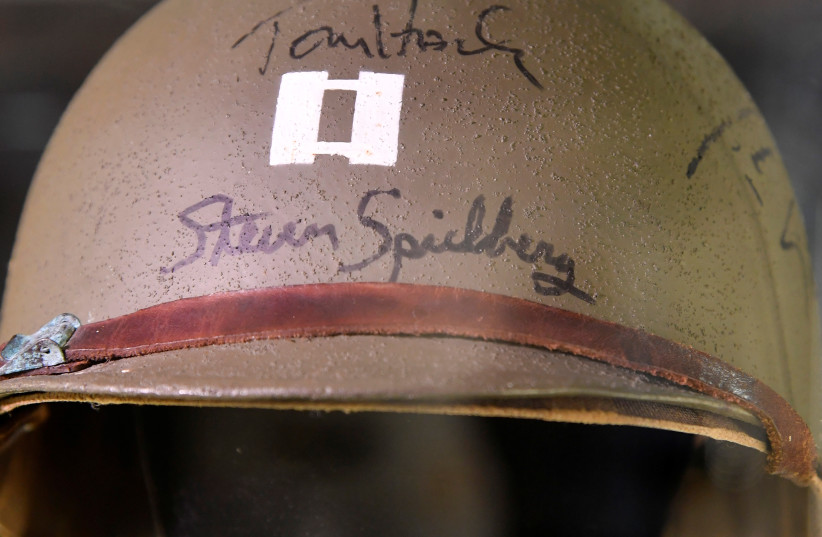 Detail is seen of Captain Miller's Helmet, worn by Tom Hanks and signed by him and director Steven Spielberg , from the 1998 film Saving Private Ryan, on display at the IMAX ahead of being auctioned later this month in London, Britain, September 6, 2018. (credit: TOBY MELVILLE/REUTERS)