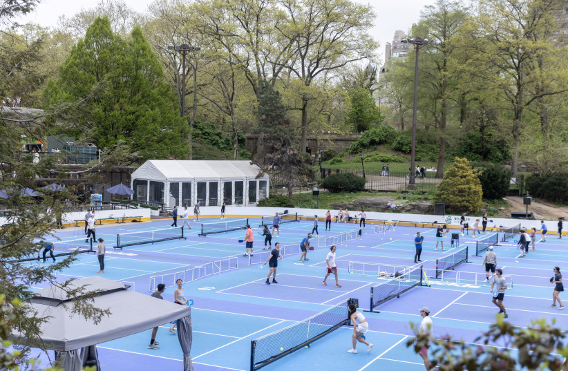 People play pickleball at Central Park in New York, U.S., April 15, 2023. (credit: JEENAH MOON/REUTERS)