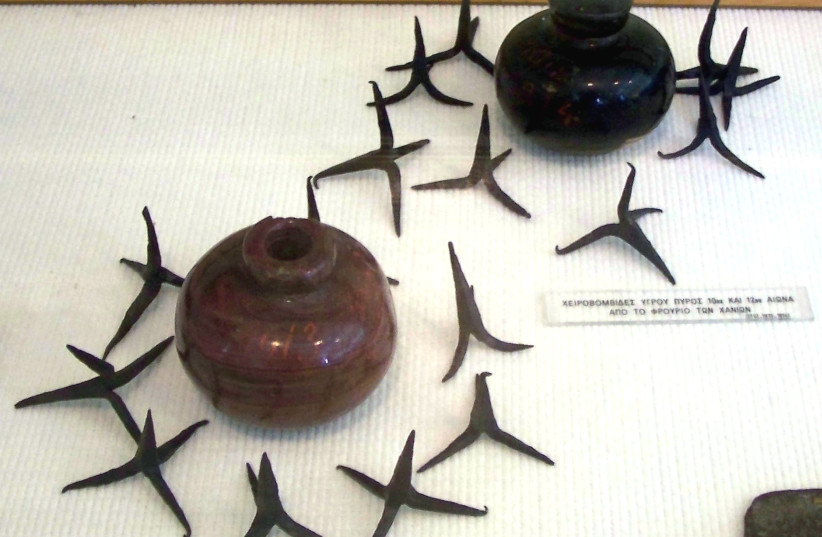  Ceramic grenades that were filled with Greek fire, surrounded by caltrops, 10th–12th century, National Historical Museum, Athens, Greece. (credit: Wikimedia Commons)