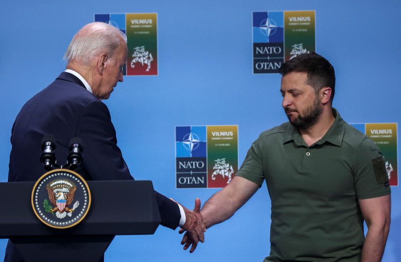  US President Joe Biden and Ukraine's President Volodymyr Zelenskiy shake hands during an event with G7 leaders to announce a Joint Declaration of Support to Ukraine, as the NATO summit is held in Vilnius, Lithuania July 12, 2023. (credit: REUTERS/KACPER PEMPEL)