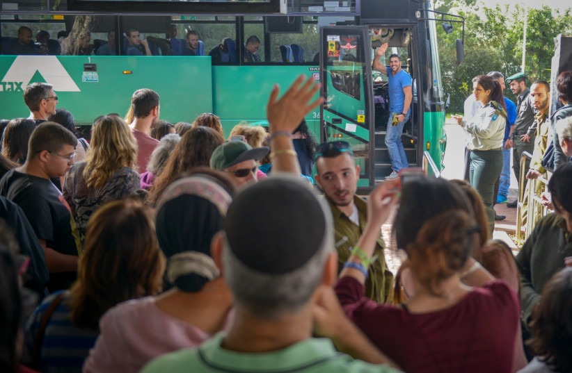 New soldiers saying goodbye to their families on recruitment day. (credit: IDF SPOKESPERSON'S OFFICE)