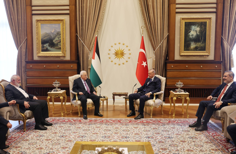  Turkey's President Recep Tayyip Erdogan and Turkish Foreign Minister Hakan Fidan meet with Palestinian President Mahmoud Abbas and Palestinian group Hamas' top leader Ismail Haniyeh at the Presidential Palace in Ankara, Turkey, July 26, 2023. (credit: Palestinian President Office(PPO)/Handout via REUTERS)