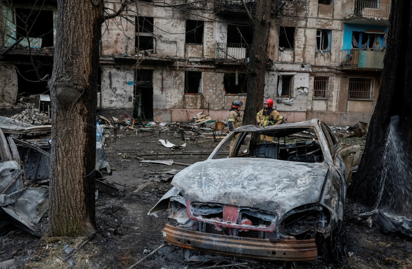  Rescuers work at a site of a residential building heavily damaged by a Russian missile strike, amid Russia's attack on Ukraine, in Kryvyi Rih, Dnipropetrovsk region, Ukraine June 13, 2023. (credit: REUTERS/Alina Smutko)