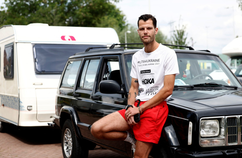  Dutch runner Boas Kragtwijk poses after an interview with Reuters in Amsterdam, Netherlands July 21, 2023. He will run from Amsterdam to Kyiv to raise money for Ukraine.  (credit: REUTERS)