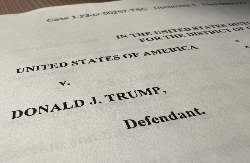  The opening page of an indictment against former US President Donald Trump is seen after he was hit with criminal charges for a third time in four months - this time arising from efforts to overturn his 2020 US election defeat, in a photo illustration August 1, 2023. (credit: REUTERS/Kevin Fogarty/Photo Illustration)