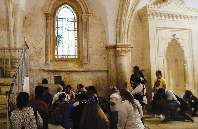  TOURISTS GATHER in the Room of the Last Supper: Some under impression damage was ancient, not recent. (credit: I.H. Mintz)