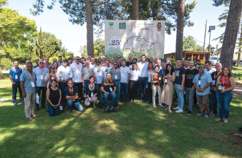 THE WINERIES of Judea get together for a group photo to celebrate 25 years of working together to market the region.