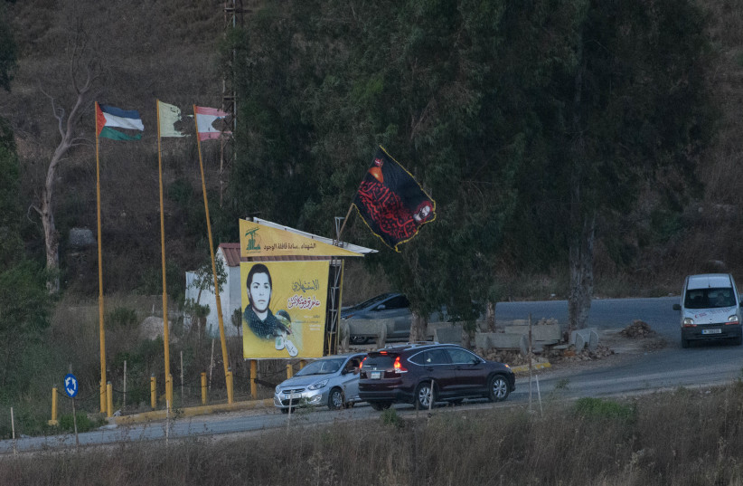 The Hezbollah flag and the Palestinian flag near the border between Lebanon and northern Israel. July 19, 2023
