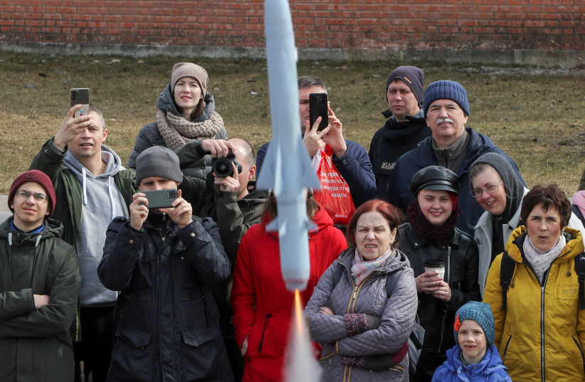  Spectators watch the launch of a model rocket during a show dedicated to Cosmonautics Day in Saint Petersburg, Russia, April 16, 2023 (credit: REUTERS/ANTON VAGANOV)