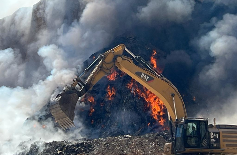  Fire at illegal trash dumping ground caused dangerous air pollution level in Binyamin region of the West Bank on August 7, 2023. (credit: TOVAH LAZAROFF)