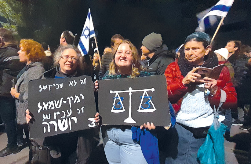  Marne Rochester (left) with a sign that reads, ‘It’s not a matter of Left or Right; it’s a matter of integrity.’ (credit: MARNE ROCHESTER)
