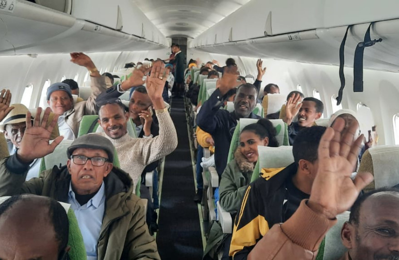  Israelis and Ethiopians who were rescued from Ethiopia on the flight to Israel. (credit: ISRAELI EMBASSY ETHIOPIA)