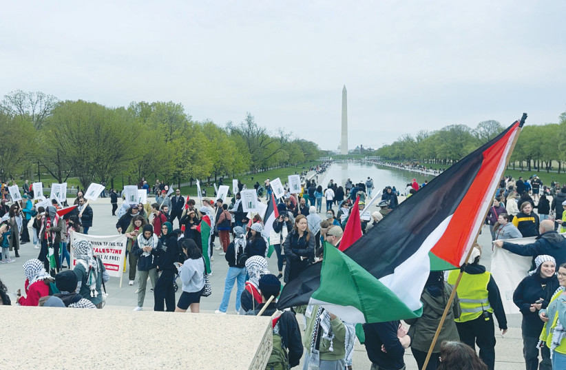  PRO-PALESTINIAN/anti-Israel groups hold a demonstration across from the Washington Monument, earlier this year. A sign reads: ‘From the river to the sea, Palestine will be free.’ (credit: Sabrina Soffer)