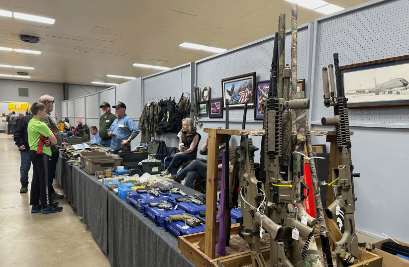  AR-10s for sale at the Belle-Clair Fairgrounds & Expo Center Gun Show, after the state of Illinois passed its ''assault weapons'' ban into law, in Belleville, Illinois, U.S., January 14, 2023. (credit: REUTERS/KATE MUNSCH)