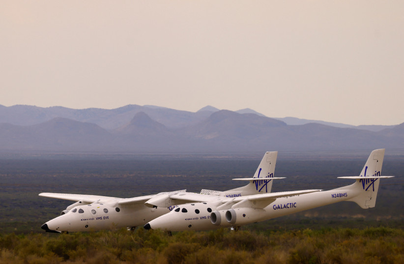  VMS Eve, operated by Virgin Galactic, returns after the company's first commercial flight to the edge of space, at the Spaceport America facility, in Truth or Consequences, New Mexico, U.S., June 29, 2023. (credit: REUTERS/JOSE LUIS GONZALEZ)