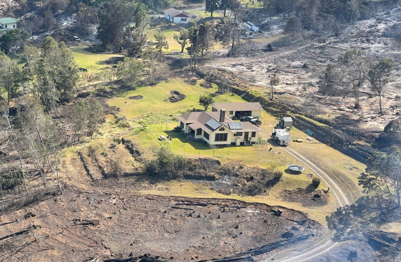  A house stands surrounded by scorched vegetation after wildfires driven by high winds burned across Kula on the island of Maui, Hawaii, U.S. August 11, 2023. (credit: REUTERS)