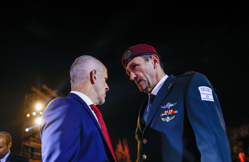 IDF Chief of Staff Herzi Halevi speaks with Ronen Bar, head of the Shin Bet security services during a ceremony held at the Yad Vashem Holocaust Memorial Museum in Jerusalem, as Israel marks annual Holocaust Remembrance Day. April 17, 2023.  (credit: ERIK MARMOR/FLASH90)