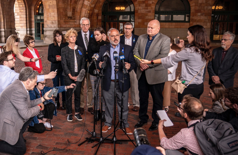  Pittsburgh Jewish Federation CEO Jeff Finkelstein speaks to the press after a jury find the gunman who shot 11 Jewish worshipers guilty of federal crimes. The writer kneels at lower left, in Pittsburgh, June 16, 2023. (credit: Alexandra Wimley/Pittsburgh Union Progress via Pittsburgh Jewish Chronicle)