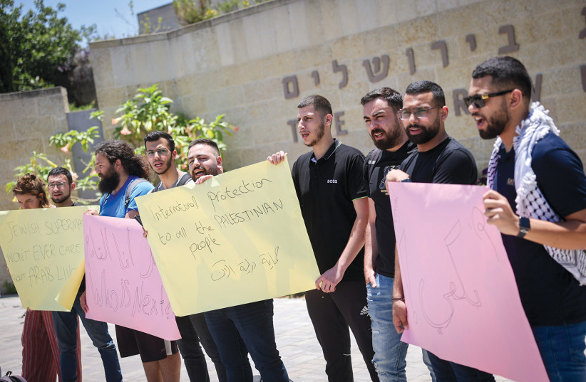  ARAB STUDENTS at the Hebrew University protest against violence within the Arab community, at the Mount Scopus campus in Jerusalem, in June.  (credit: YONATAN SINDEL/FLASH90)