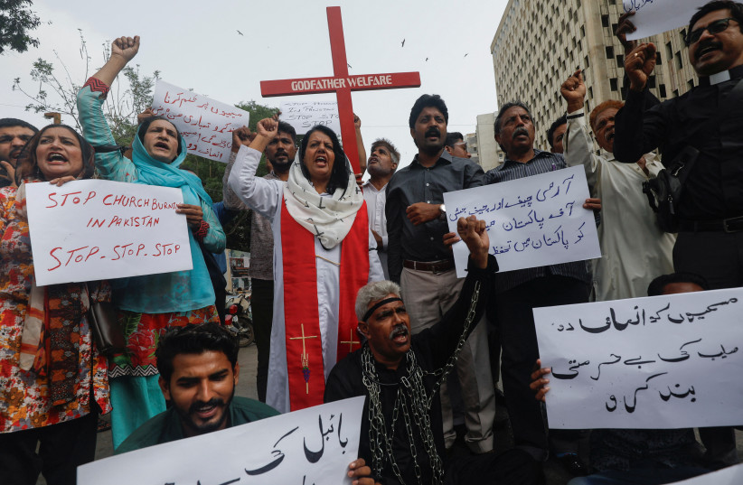  Members of the Christian community chant slogans as they hold placards to condemn the attacks on churches and houses in Jaranwala town of Faisalabad, during a protest in Karachi, Pakistan August 17, 2023 (credit: REUTERS/AKHTAR SOOMRO)