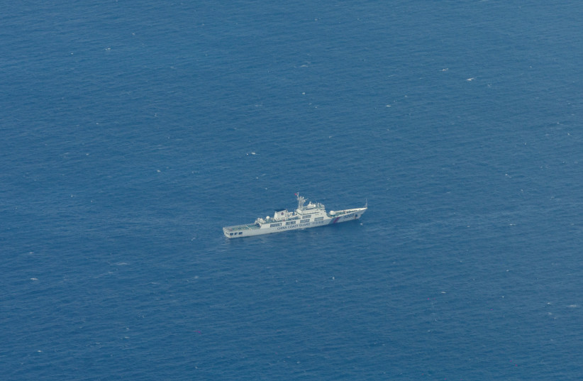  A Chinese Coast Guard vessel is pictured near the Philippine-occupied Thitu Island, in the disputed Spratly Islands, South China Sea, March 9, 2023. (credit: REUTERS/ELOISA LOPEZ)