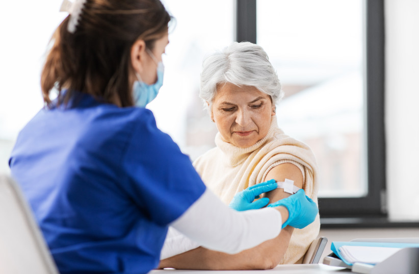  An older woman receives a vaccine (illustrative) (credit: INGIMAGE)