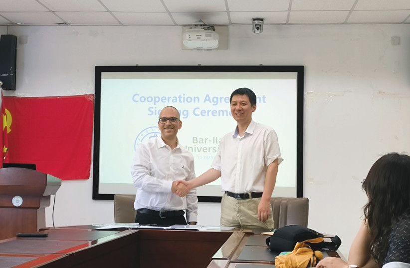  DR. YOSSI BEN-ZION and Prof. Tu Zhanchun following the signing ceremony of the cooperation agreement between BIU and BNU. (credit: Courtesy BNU)