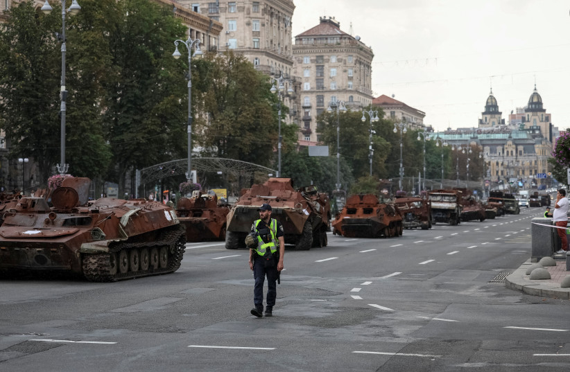 People attend an exhibition displaying destroyed Russian military vehicles located on the main street Khreshchatyk as part of the upcoming celebration of the Independence Day of Ukraine, amid Russia's invasion, in central Kyiv, Ukraine August 21, 2023. (credit: GLEB GARANICH/REUTERS)