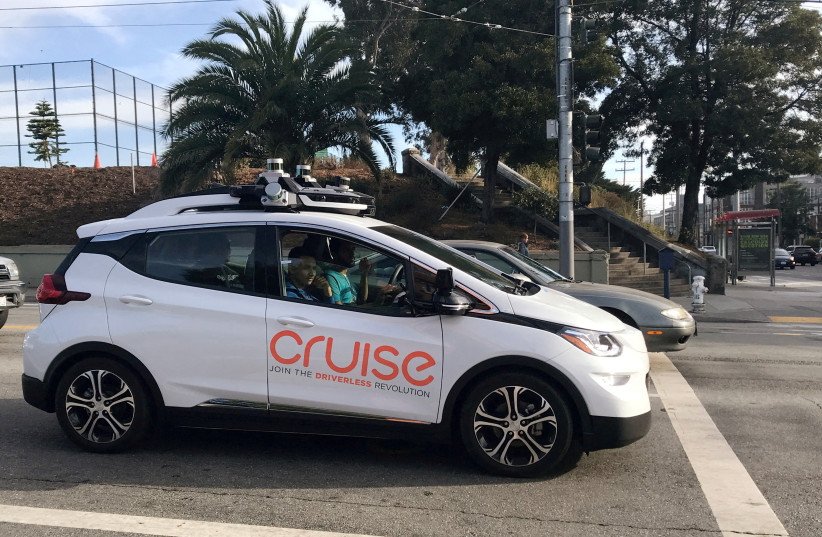 A Cruise self-driving car, which is owned by General Motors Corp, is seen outside the company?s headquarters in San Francisco where it does most of its testing, in California, U.S., September 26, 2018. (credit: REUTERS/Heather Somerville/File Photo)