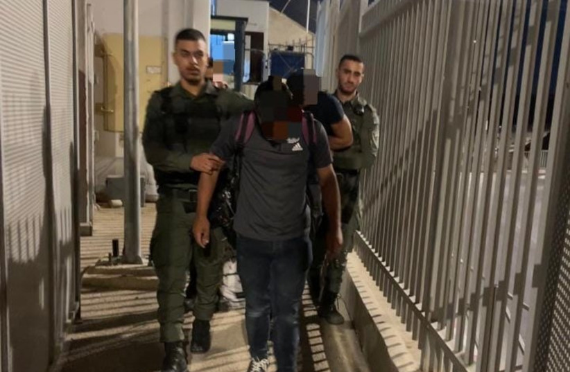  The armed Palestinian suspect caught attempting to cross into Israel on August 28, 2023 (credit: BORDER POLICE)