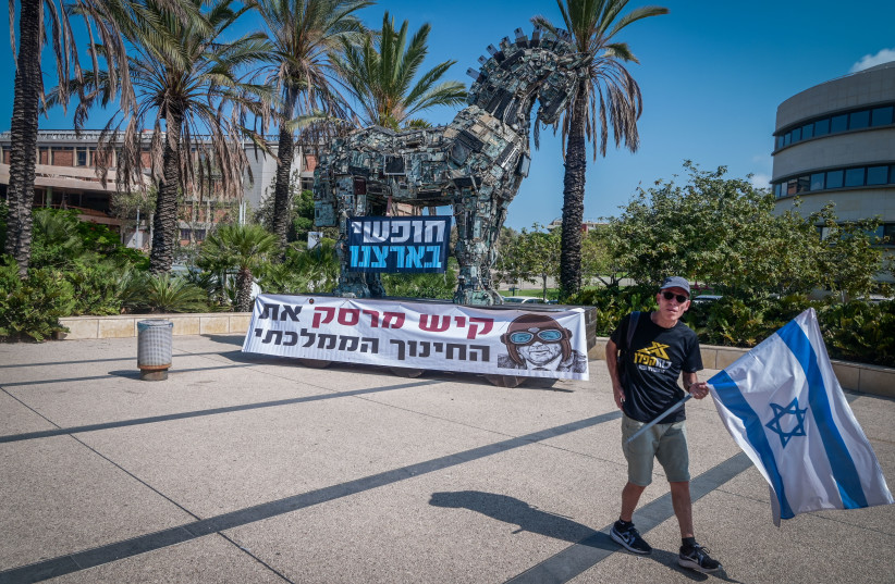  Israeli protest against Education Minister Yoav Kisch outside a conference at Tel Aviv University, on August 28, 2023. (credit: AVSHALOM SASSONI/FLASH90)