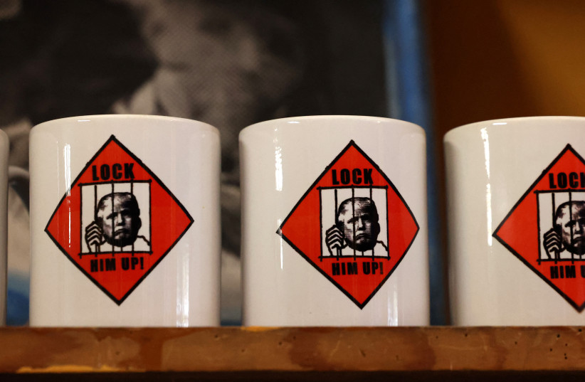 Coffee mugs with an image depicting the mugshot of former U.S. President Donald Trump are pictured after being printed at the Y-Que printing store in Los Angeles, California, U.S., August 26, 2023. (credit: REUTERS/MARIO ANZUONI)
