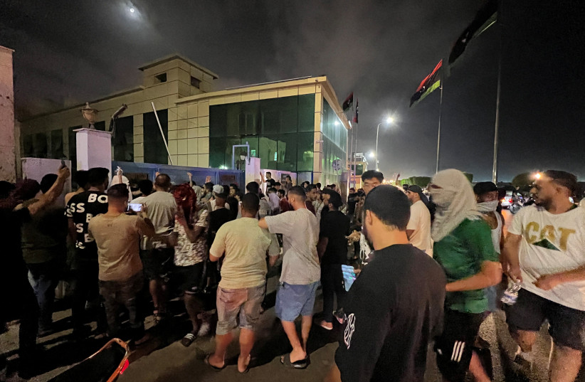  Demonstrators gather in front of the state broadcaster's building in protest against the meeting which was held last week in Italy between foreign affairs ministers of Libya and Israel, in Tripoli, Libya, August 29, 2023. (credit: AYMAN AL-SAHILI/REUTERS)
