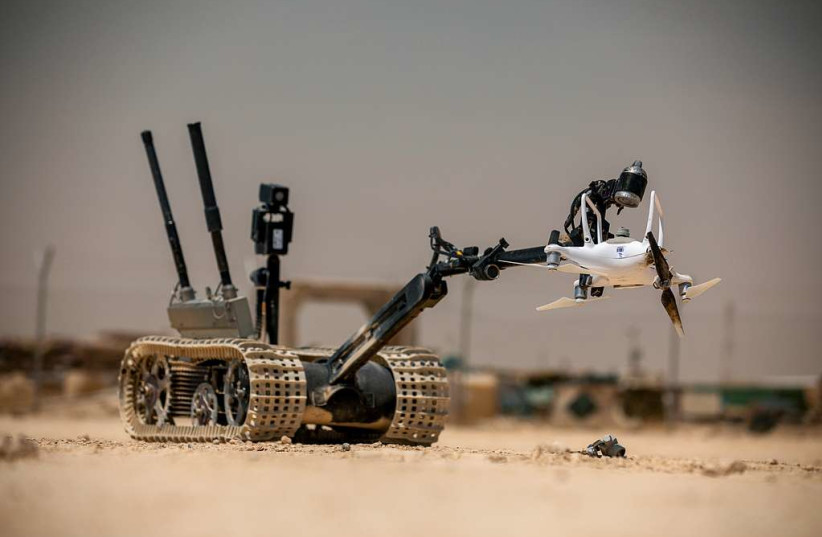  A TALON tracked military robot picks up a downed unmanned aerial system at Al Asad Air Base, Iraq, May 19, 2020. (U.S. Army photo by Spc. Derek Mustard) (credit: PICRYL)