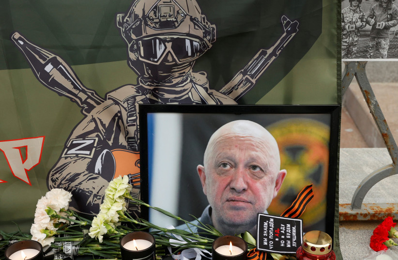  A view shows a portrait of Wagner mercenary chief Yevgeny Prigozhin at a makeshift memorial in Moscow, Russia August 24, 2023. (credit: REUTERS/STRINGER)
