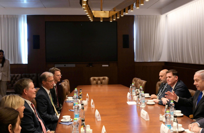  Prime Minister Benjamin Netanyahu is seen meeting with US Senator Steve Daines. (credit: AMOS BEN-GERSHOM/GPO)