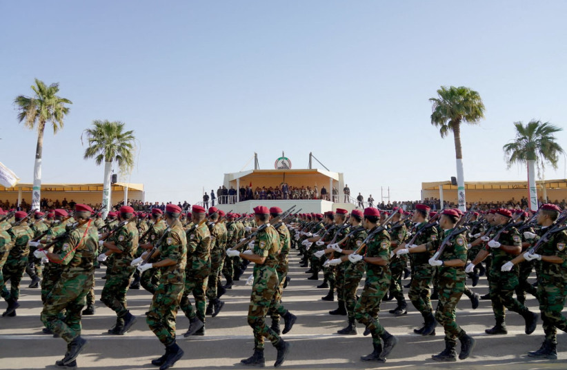 A military parade for the members of Iraqi Popular Mobilization Forces (PMF) marking its eighth anniversary, in Diyala province, Iraq July 23, 2022 (credit: IRAQI PRIME MINISTER MEDIA OFFICE/HANDOUT VIA REUTERS)