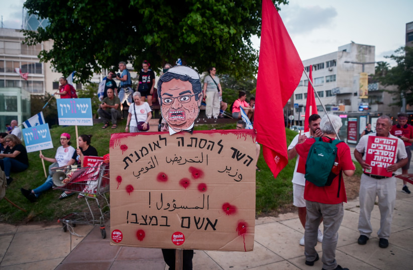 Demonstrator holding a sign reading ''the minister for nationalist incitement is responsible for the situation!'' at a protest against the violence in the Israeli Arab Community and the government's judicial overhaul, in Tel Aviv. August 26, 2023. (credit: AVSHALOM SASSONI/FLASH90)