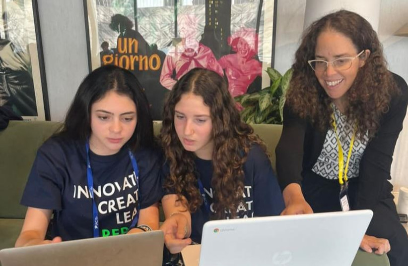   Ella, Yuval ,and their instructor Dafna all participated in a Wall Street Hack-a-thon. (credit: IAC)