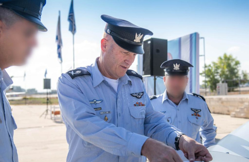  IAF Commander Maj.-Gen. Tomer Bar places a sticker on the new ''Spark'' UAV (credit: ISRAEL AIR FORCE)
