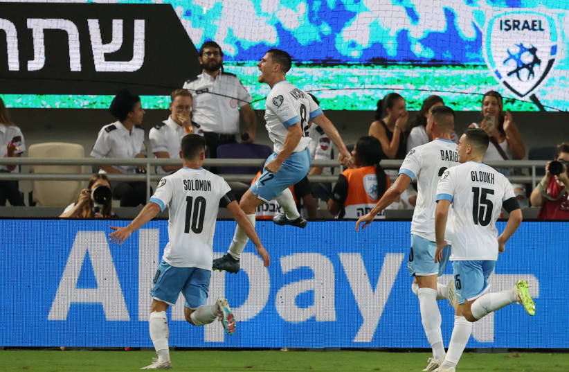  GABY KANICHOWSKY (jumping in air) celebrates with his Israel teammates after scoring in stoppage time late Tuesday night to give the blue-and-white a 1-0 victory over visiting Belarus at Bloomfield Stadium in their Group I Euro 2024 qualifier. (credit: RONEN ZVULUN/REUTERS)