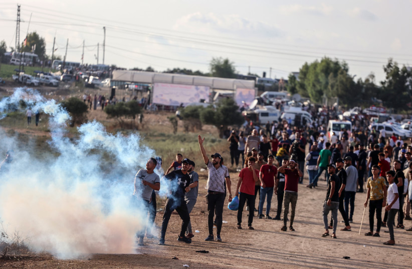  Palestinian demonstrators clash with Israeli soldiers at the Israel-Gaza border fence, east of Gaza City September 13, 2023. (credit: ATIA MOHAMMED/FLASH90)