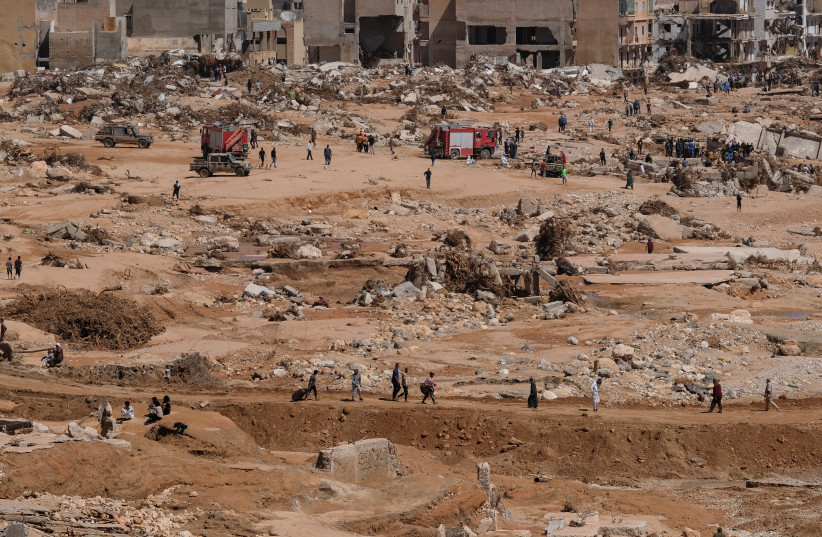  A view shows people inspecting the damaged areas, in the aftermath of the floods in Derna, Libya September 14, 2023 (credit: REUTERS)