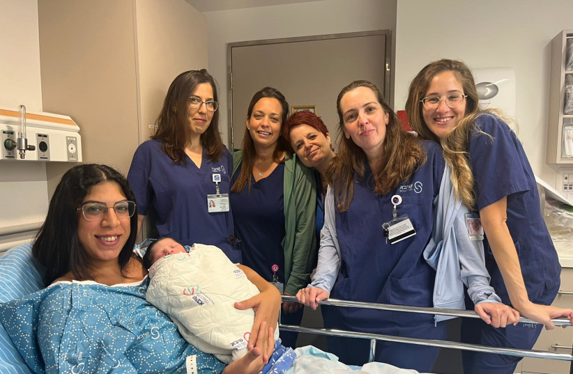  Rachel Dotan, from Rishon Lezion, is seen with her newborn daughter on Rosh Hashanah eve (credit: SHEBA MEDICAL CENTER)
