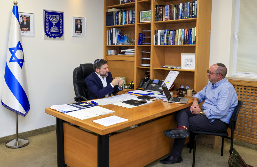  Finance Minister Bezalel Smotrich and Jerusalem Post's Zvika Klein interviewing him in the Finance Minsiter's office, 2023. (credit: MARC ISRAEL SELLEM)