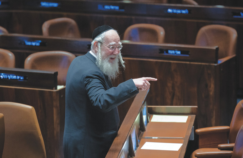  UTJ MK Yisrael Eichler points at a fellow lawmaker in the Knesset plenum. (credit: YONATAN SINDEL/FLASH90)